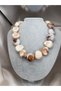 STUNNING MODERN DESIGN WOMEN'S NECKLACE WITH LARGE OVAL BEADS, MARBLE PATTERN, AND AN ASYMMETRICAL SHAPE