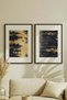 2 VINTAGE PAINTINGS WITH BLACK WOODEN FRAMES FEATURING ABSTRACT LANDSCAPES WITH FOREST AND WATER THEMES - 2
