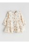 From UZG STORE: A Stylish Ruffled, Printed Baby Girl Dress with a Peter Pan Collar and Yoke Detail for Fashion-Conscious Parents - 3