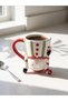 كوب سيراميك بتصميم فريد من نوعه، يتميز بأشكال متنوعة ومتداخلة (W6).