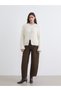 From UZG STORE: A Women's Knit Cardigan with a Round Neck and Tasseled Collar Detail for Fashion-Conscious Women - 3