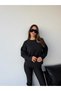 سترة نسائية سوداء أساسية بياقة دائرية وقصة فضفاضة. - 5