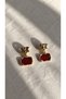 Gold Earrings with Red Accents and Dangling Elements