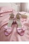 Evening dress shoes with a single strap, a pink bow detail, and a glittery sand-colored heel - 3