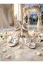 Evening dress shoes with a white bow detail, glittery sand-colored design, single-strap construction, and high heels - 3