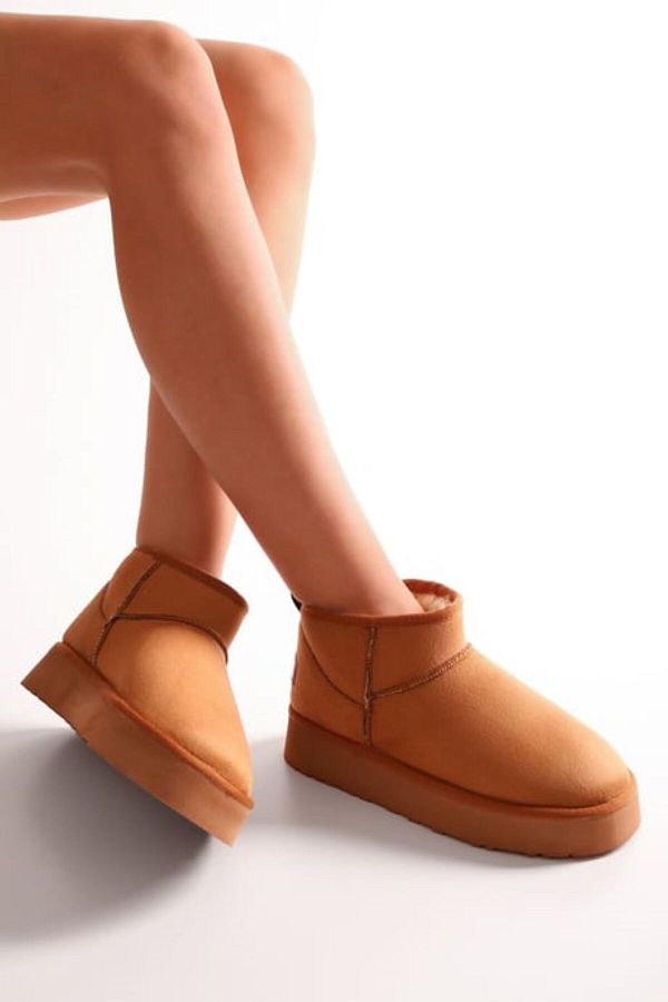 SOLMAZ-UGGYS TAN SHORT SUEDE BOOTS WITH FEATHER INSIDE 1
