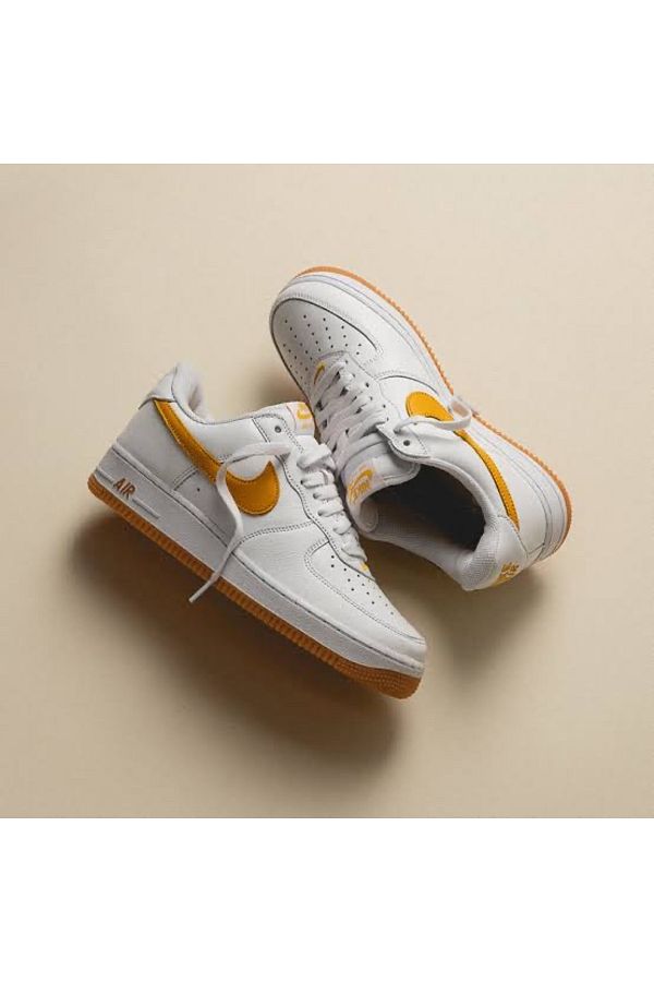 Nike air force 1 low university gold top