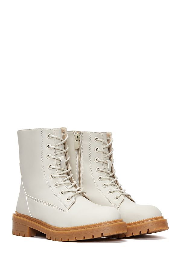 Women’s white boots by Derimod from Trendyol, With a 30% Discount!