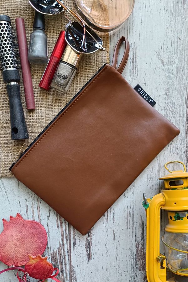 Light brown clutch bag on sale