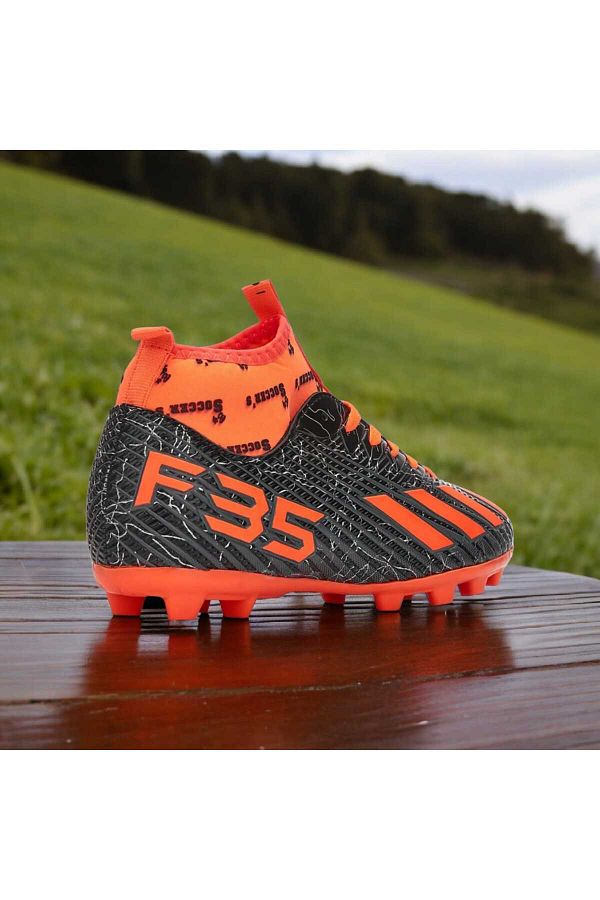 Boys orange football cleats shop