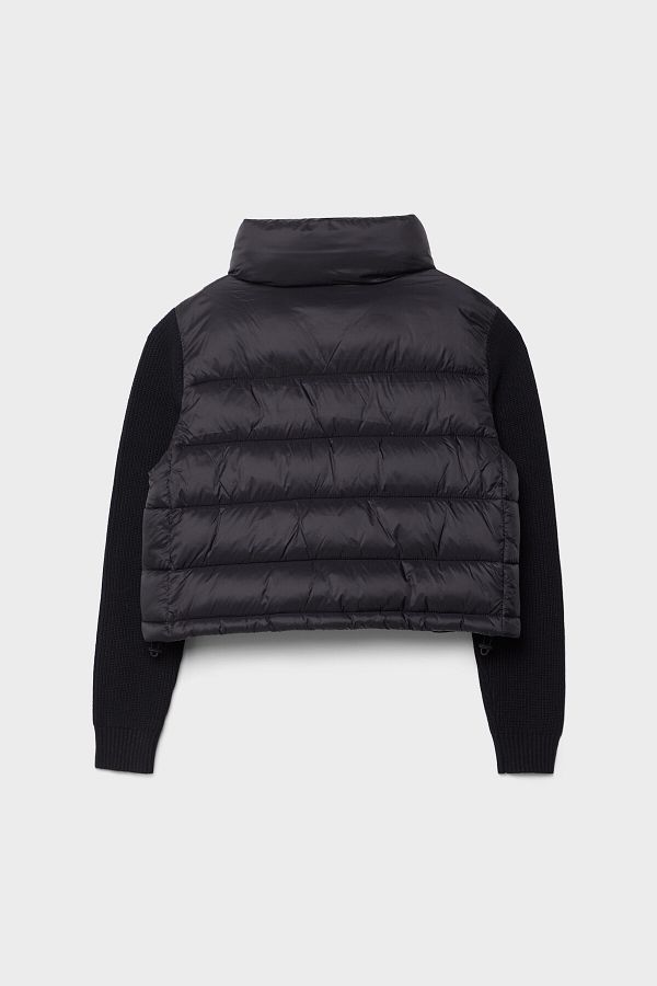 Stradivarius Puffer jacket with chunky knit sleeves Trendyol