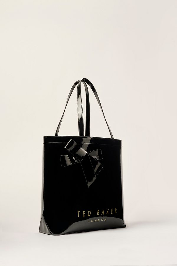 Ted baker black bag with gold bow shop