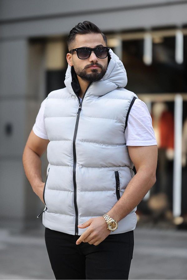 Waterproof vest with hood outlet