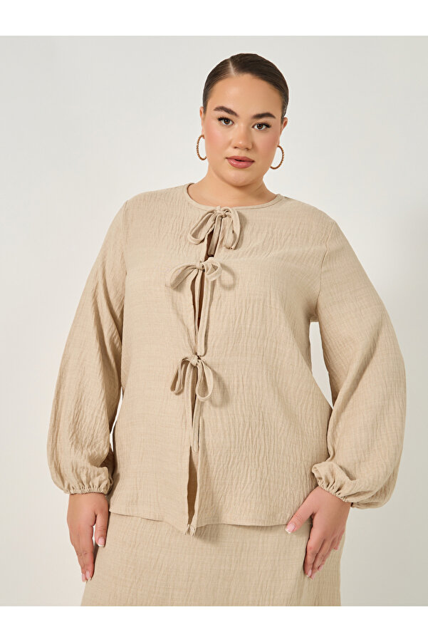 Styli Plus Size Textured Balloon Sleeve Blouse with Bow Tie-Up