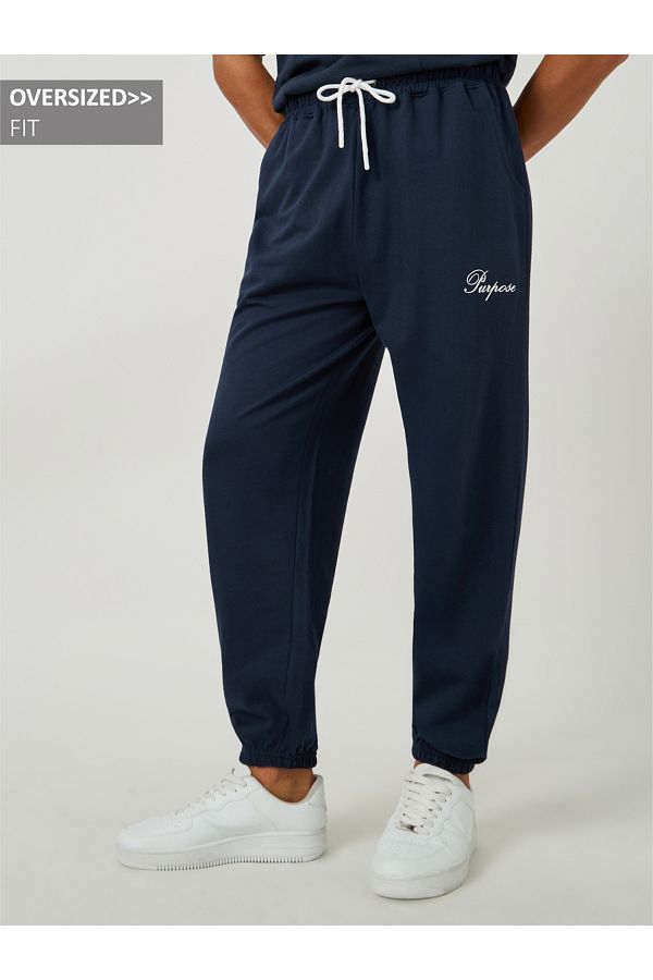 Styli-Minimal Slogan Print Oversized Joggers with Drawstring 1