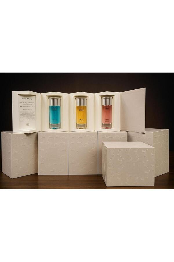 Re-"ALFARIS THE DICSALIS COLLECTION" perfume set with three perfume bottles in an elegant white box decorated with... 1