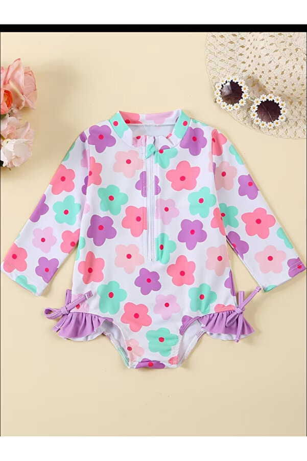 MODA Çiçek desenli kız bebek tulum mayo, uzun kollu, ince yapılı, fırfır detaylı, yaz için ideal.