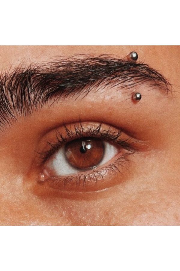 Silver eyebrow piercing 2025