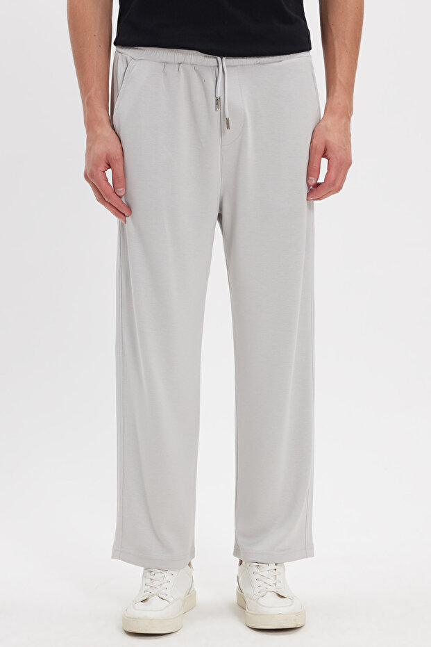 Men's stone baggy fit relaxed cut modal fabric soft texture drawstring waist side pockets sweatpants