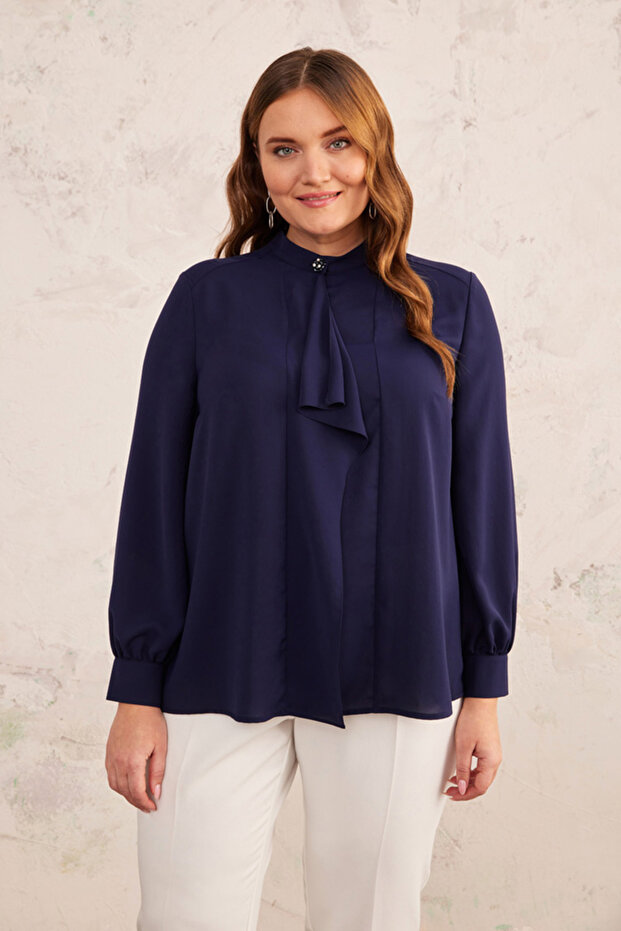 بلوزة بتفاصيل دولاب الموازنة - 1