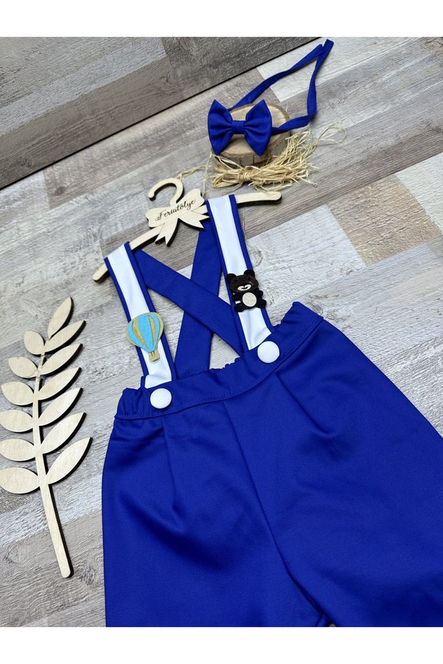 Flying balloon and teddy bear concept, sax blue and white baby boy trousers, salopette, bow tie set