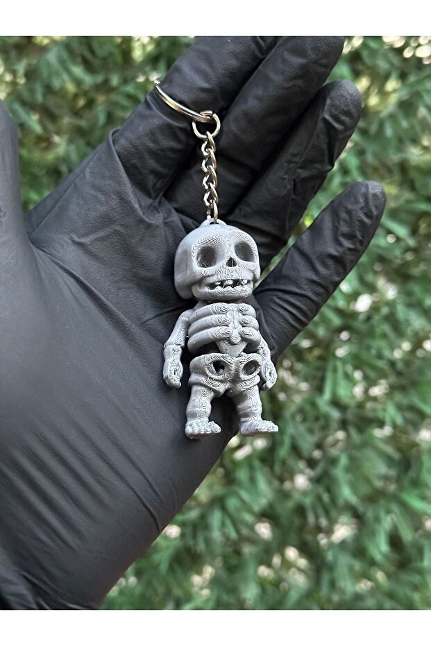 سلسلة مفاتيح متحركة ذات هيكل عظمي صغير باللون الرمادي - 3