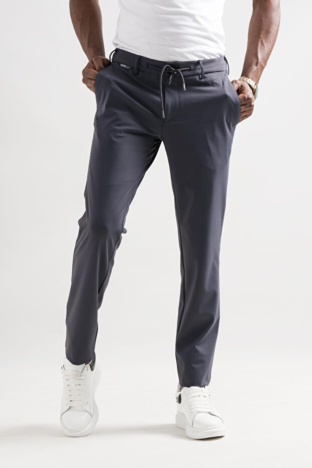 Slimfit الخصر مطاطا ومترابطة مادة البولي أميد خفيفة لامعة الشتاء النسيج الرجال عداء ببطء السراويل