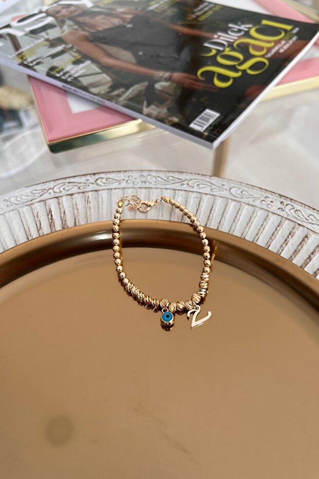 Dorica Bracelet with V Letter and Evil Eye Hanging