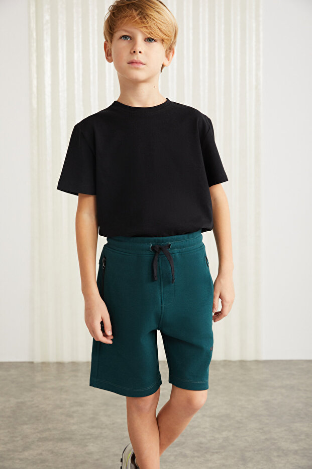 JEFFRERY-GRM24011 75% cotton 25% polyester children's shorts with interlock print and zipper Petrol Green
