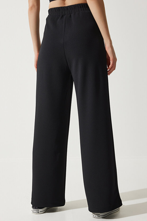 Damskie czarne spodnie dresowe z szeroką nogawką RV00193 - 7