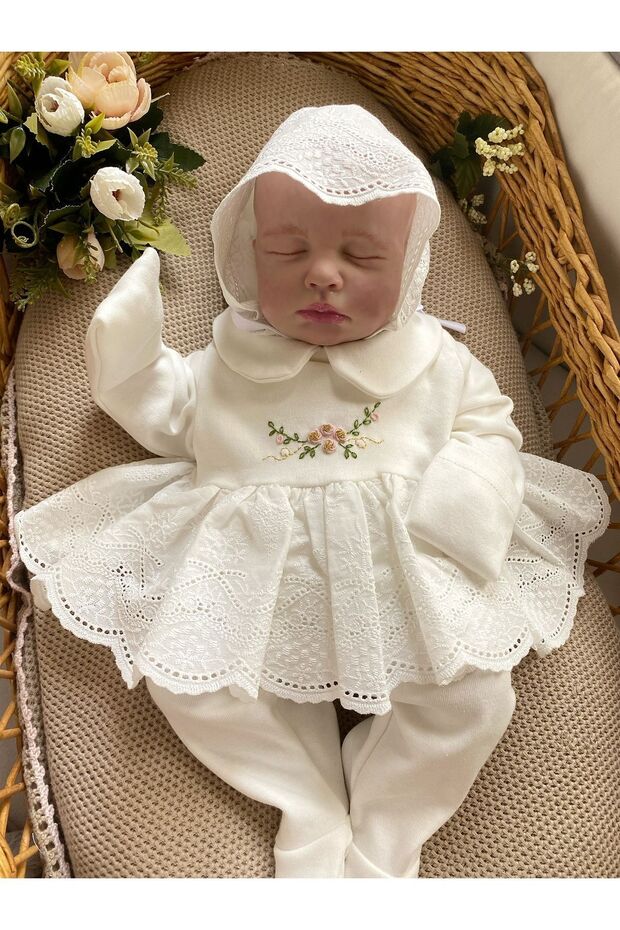 Hand-embroidered detailed baby girl hospital exit set with booties, ruffled bottoms, ruffled top, and hat.