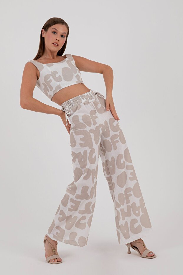 Beige Patterned Cropped top and pants set for summer.