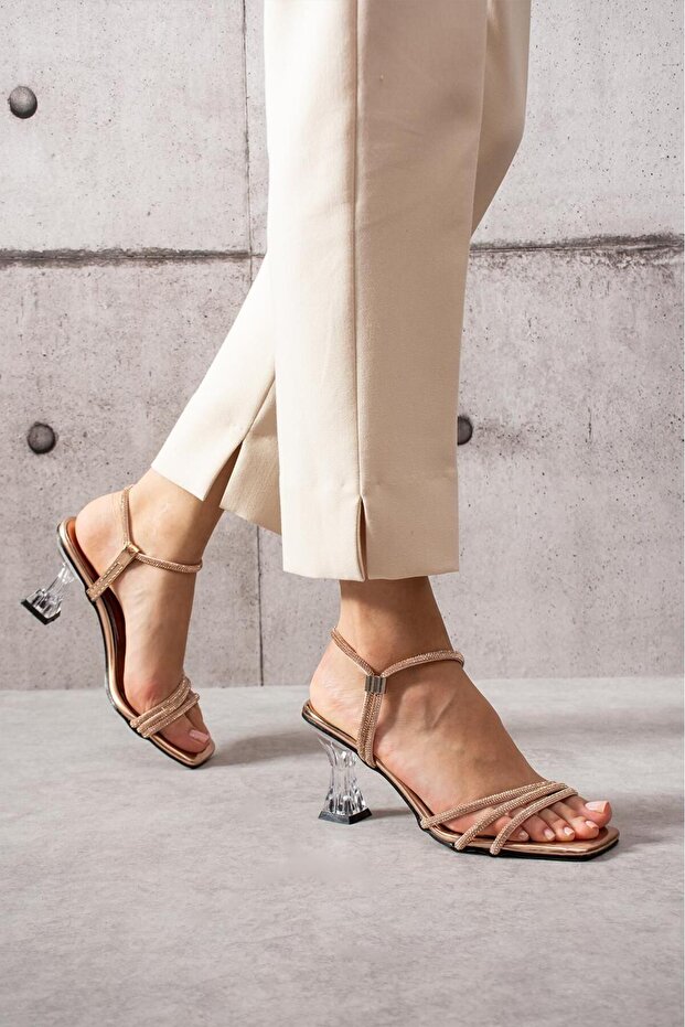 Around stone detailed high-heeled women's evening shoes.