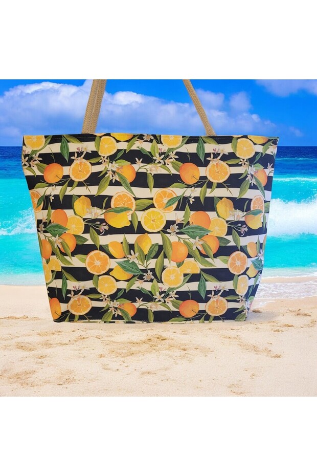 حقيبة كتف منقوشة باللون البرتقالي والليمون على الشاطئ - 2