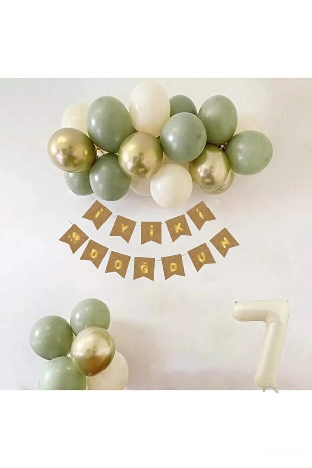Concept Birthday Set with Mold Green Sea Sand and Gold Balloons