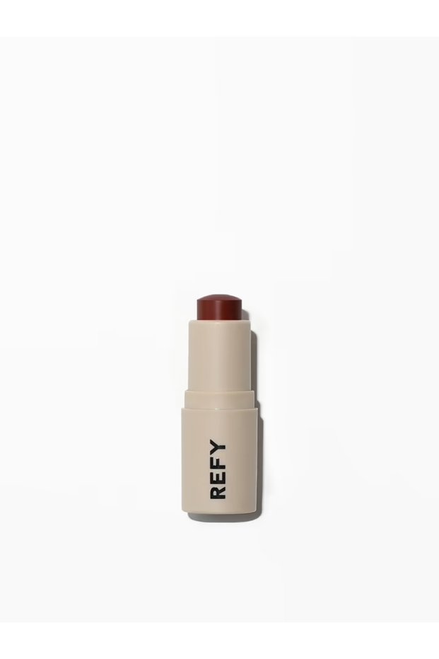 بلسم شفاه شفاف وملون من LIP BLUSH CANYON، يمنح الشفاه مظهراً غامقاً. £16.00