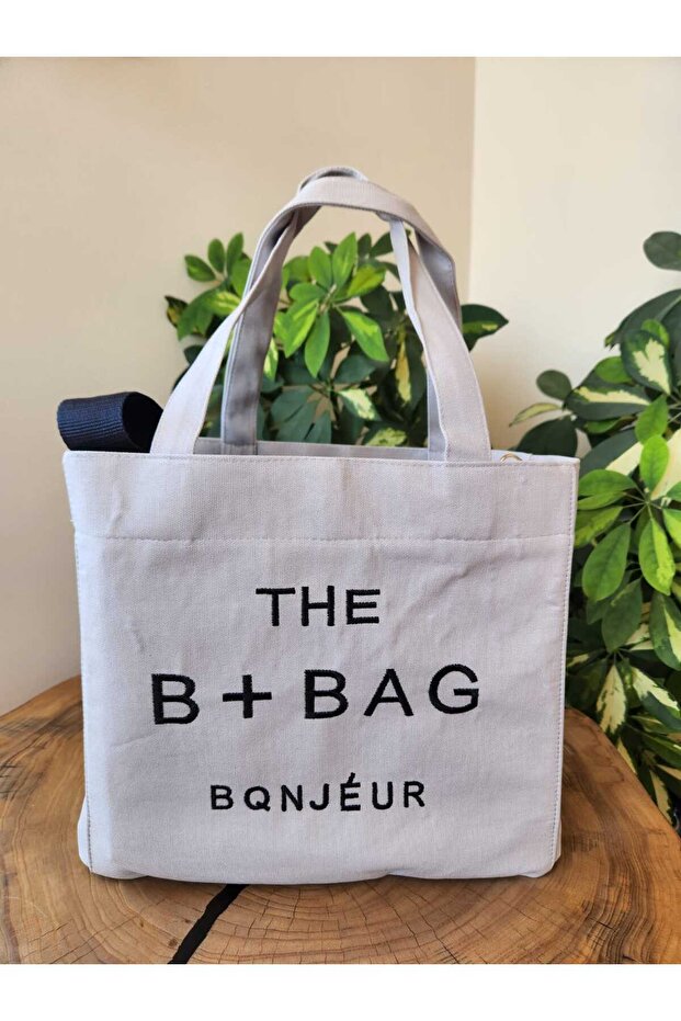 حقيبة كتف قماشية بحزام طويل باللون الرمادي من The B+Bag