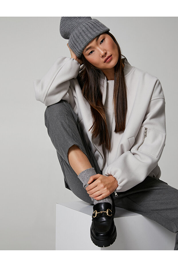 Elastic Knitted Beret with Wide Layers on the Edges