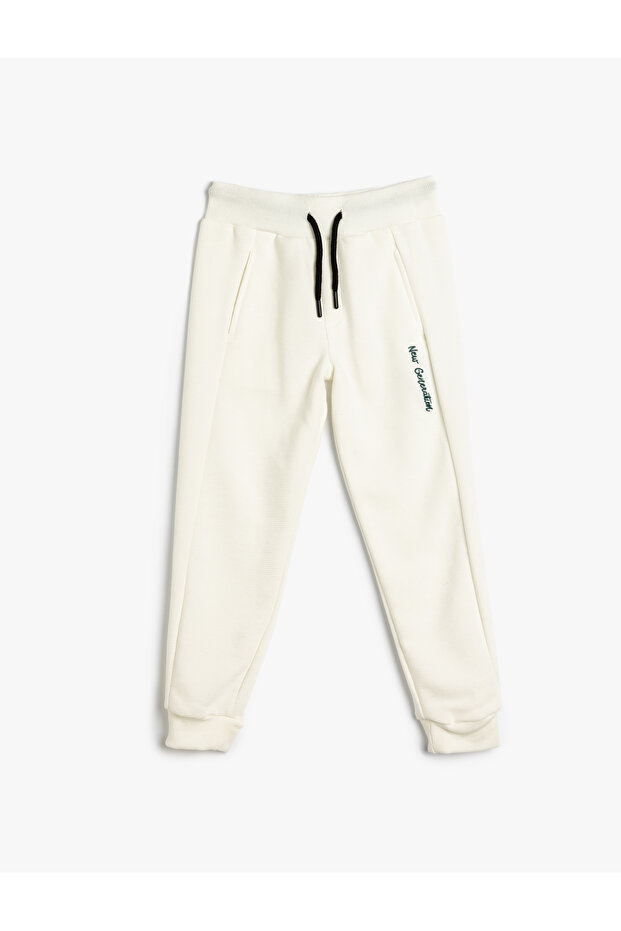 Jogginghose mit Slogan-Print und Bindegürtel - 1