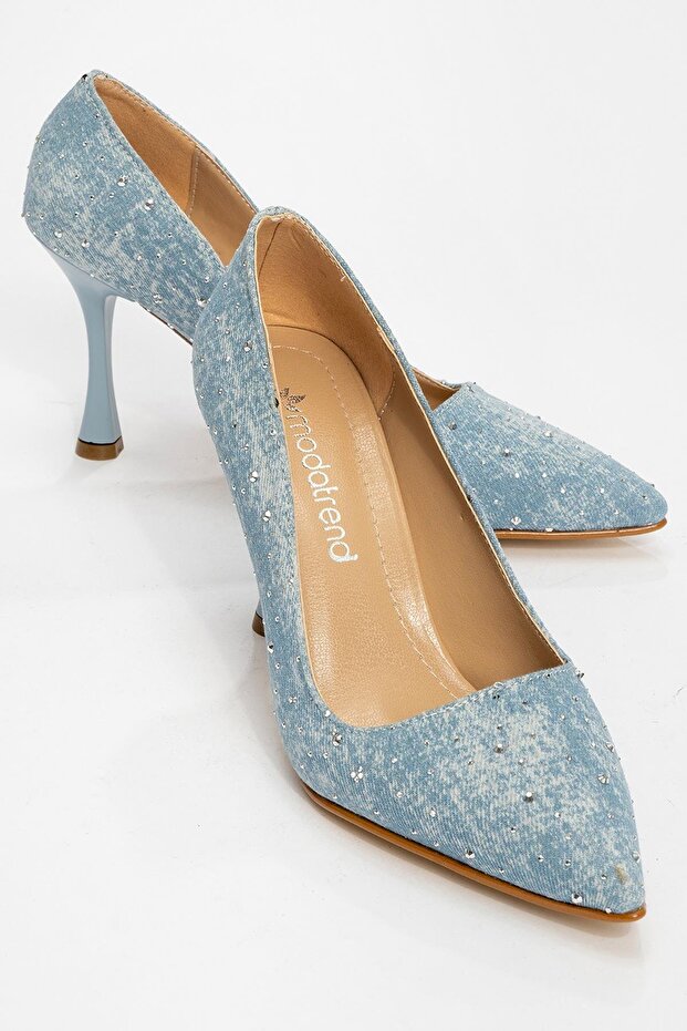 Woman's high heel shoe blue jeans