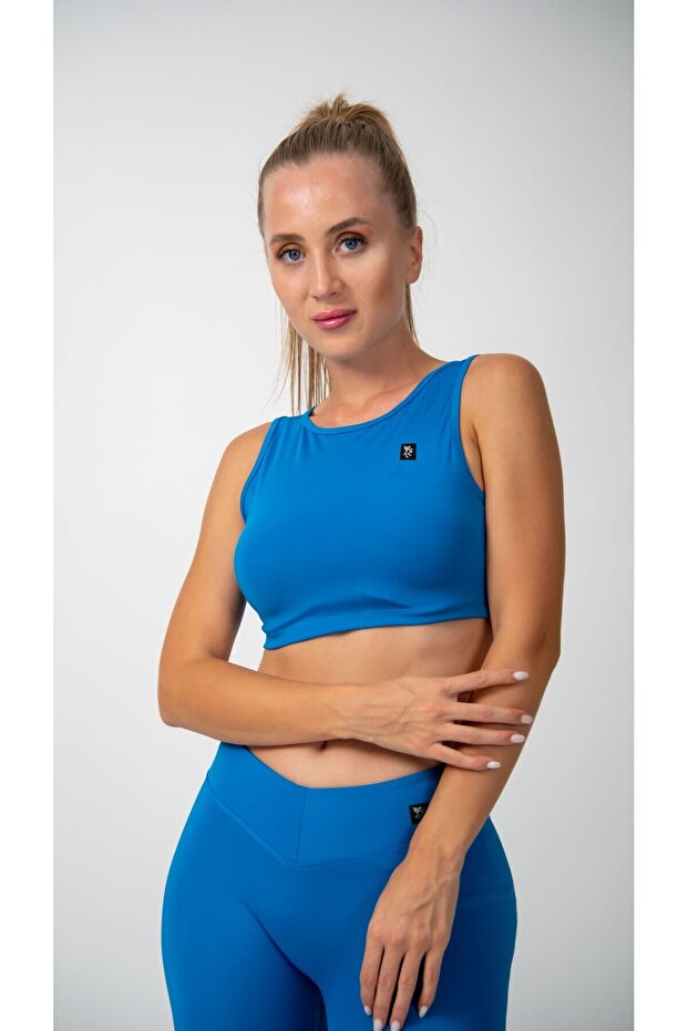 بلوزة قصيرة بدون أكمام باللون الفيروزي - 1