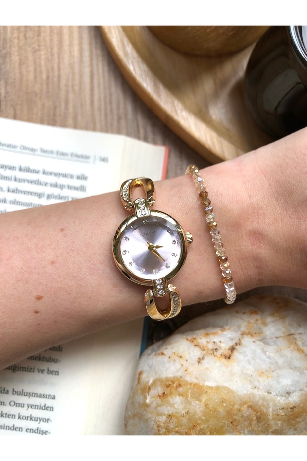 Pink Gold Women's Wristwatch with Round Cord Design Detail and Little Stones Inside