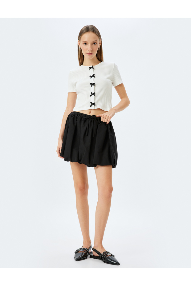 Crew neck slim fit short sleeve bowtie detail cardigan.