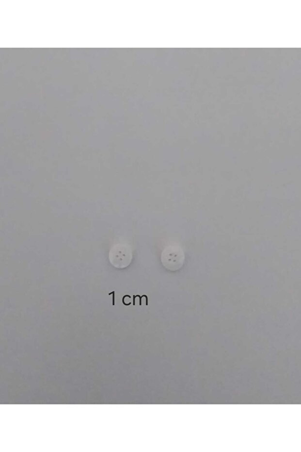 أزرار بوليستر منقوشة باللون الأبيض الفاتح قطر 1 سم 50 قطعة. - 3
