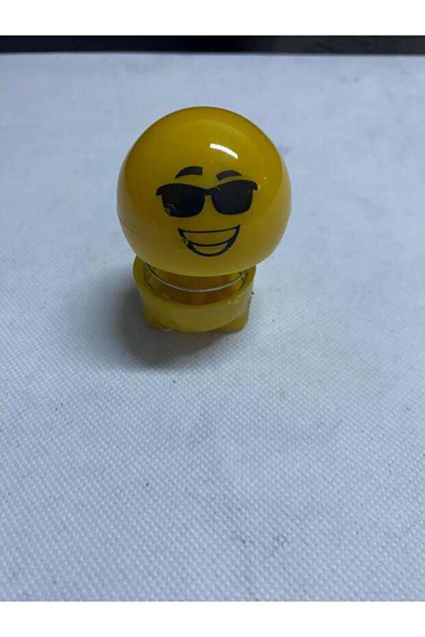 Bouncy Emoji Glasses Face on the Glove Box