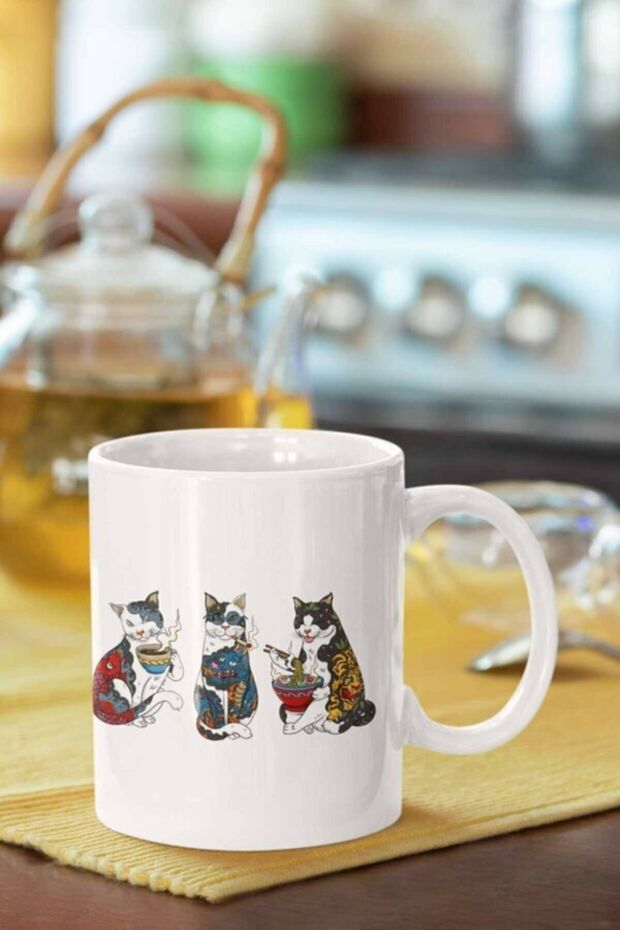 كوب مطبوع عليه قطط منقوشة - 1