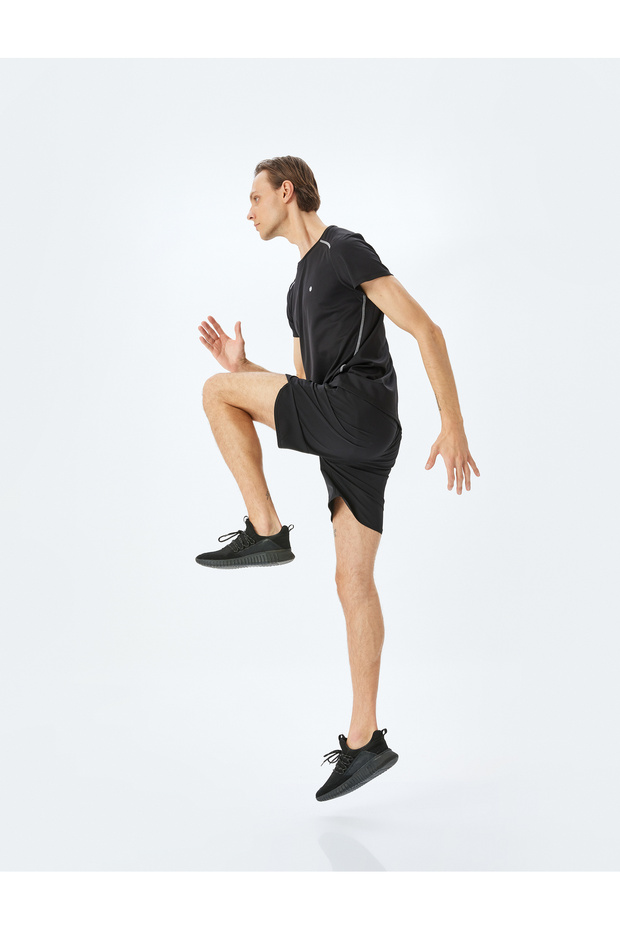Drawstring parachute fabric zipped pocket detail sport shorts.