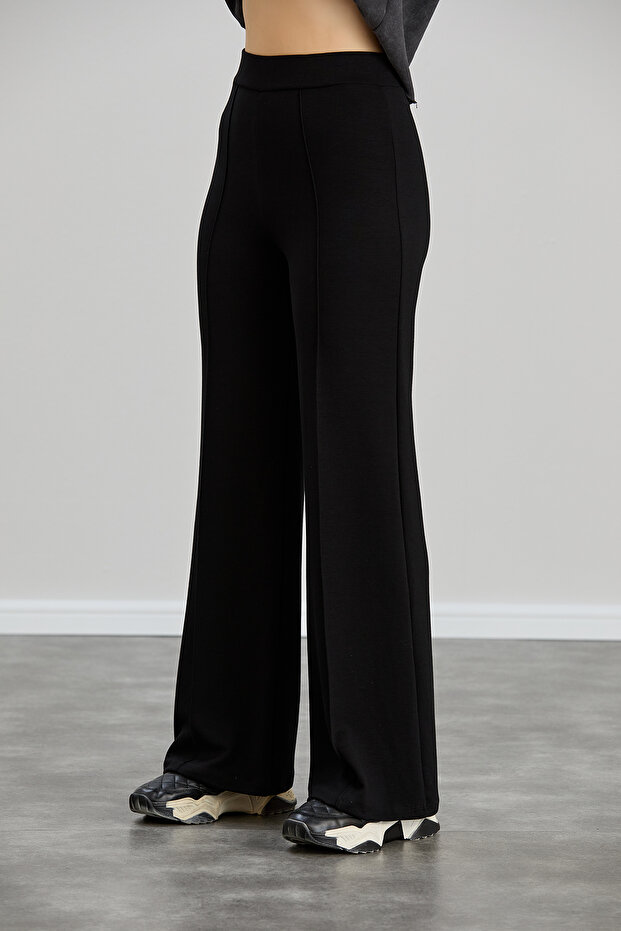 بنطال نسائي أسود مشروط واسع الساق مخطط وخصر عالي وناعم ومطاط من الليكرا - 2