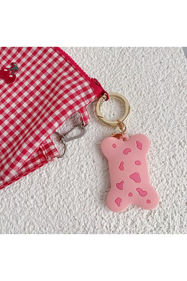 سلسلة مفاتيح من السيليكون بنمط العظام ومفصلة باللون الذهبي متوافقة مع Airtag - 1