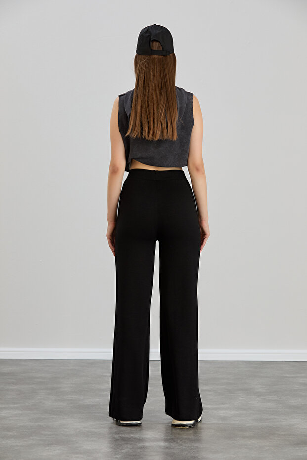 بنطال نسائي أسود مشروط واسع الساق مخطط وخصر عالي وناعم ومطاط من الليكرا - 7